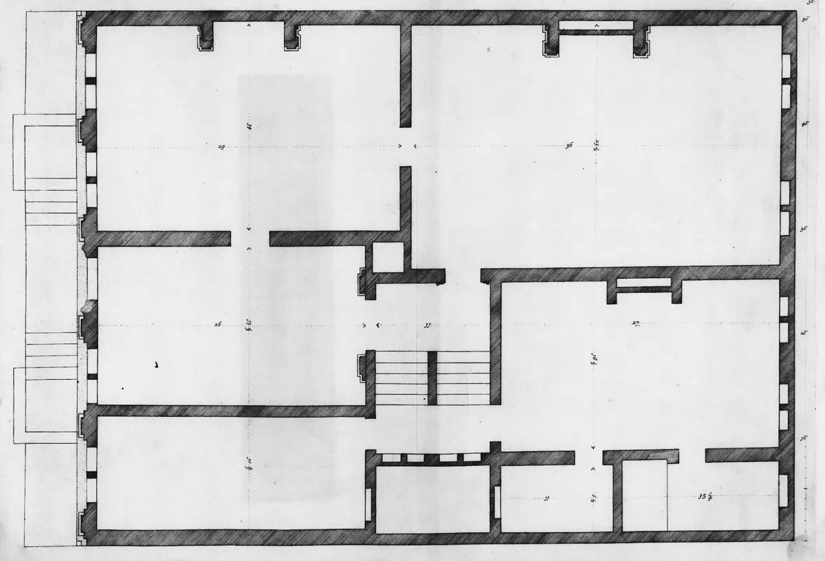 Old architectural drawing of a house floor plan with room outlines and a dimension grid.