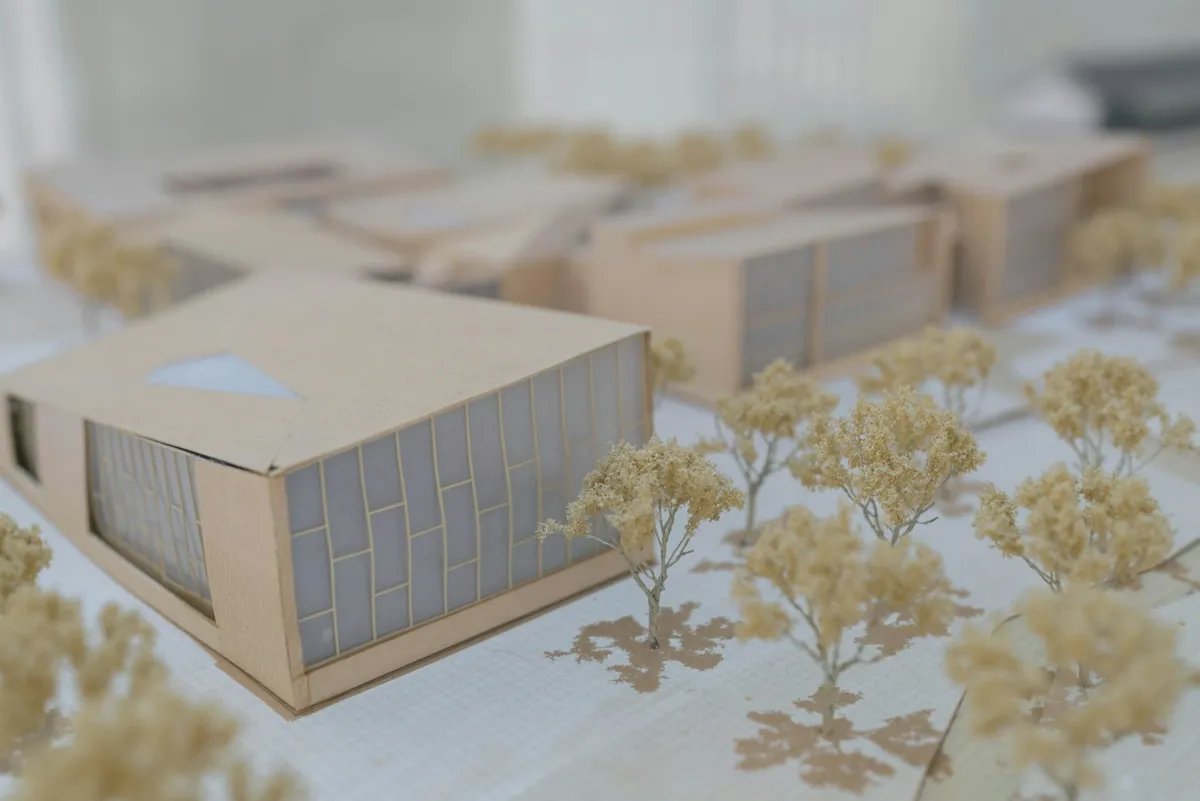 A white architectural massing model of a building.